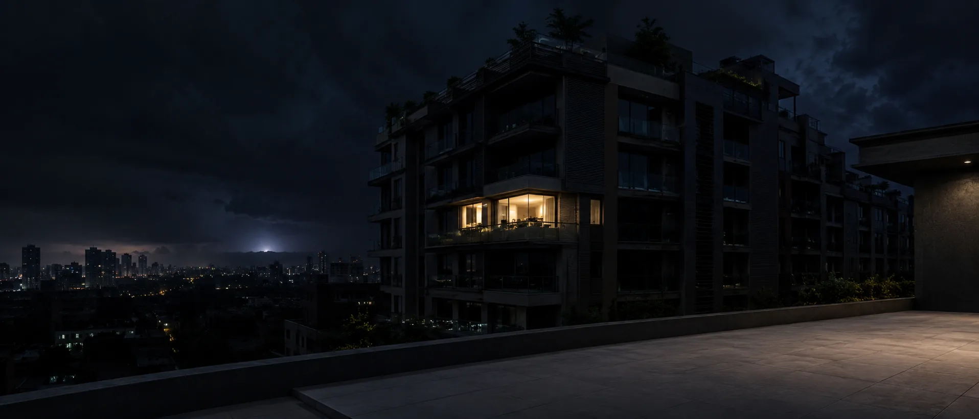 Apartment buildings during a nighttime power outage with one illuminated home